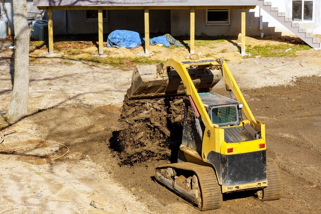 Bulldozer moving dirt during a backyard grading project in the Treasure Valley