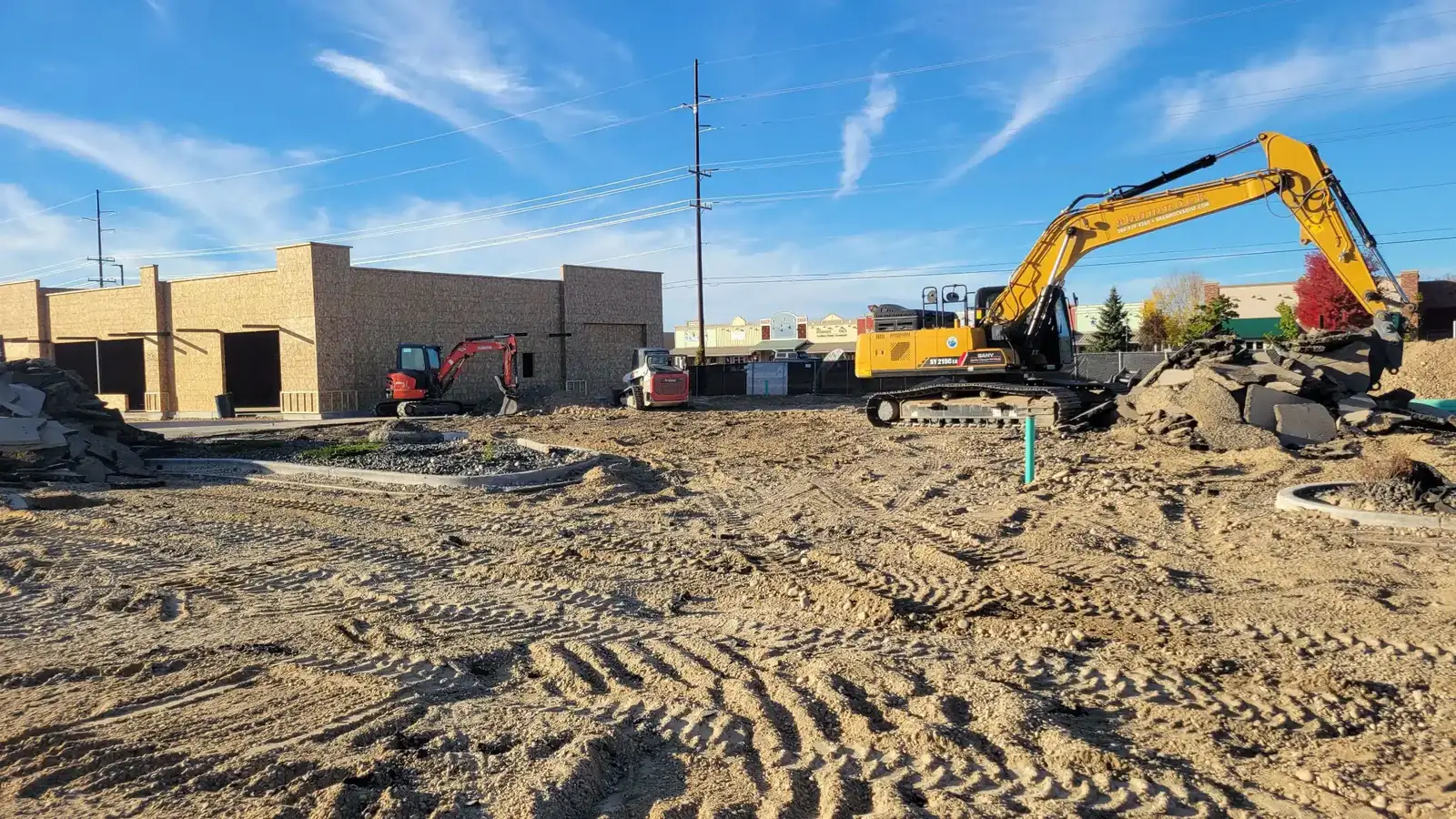 Excavator trenching for a new sewer line installation in Boise, Idaho