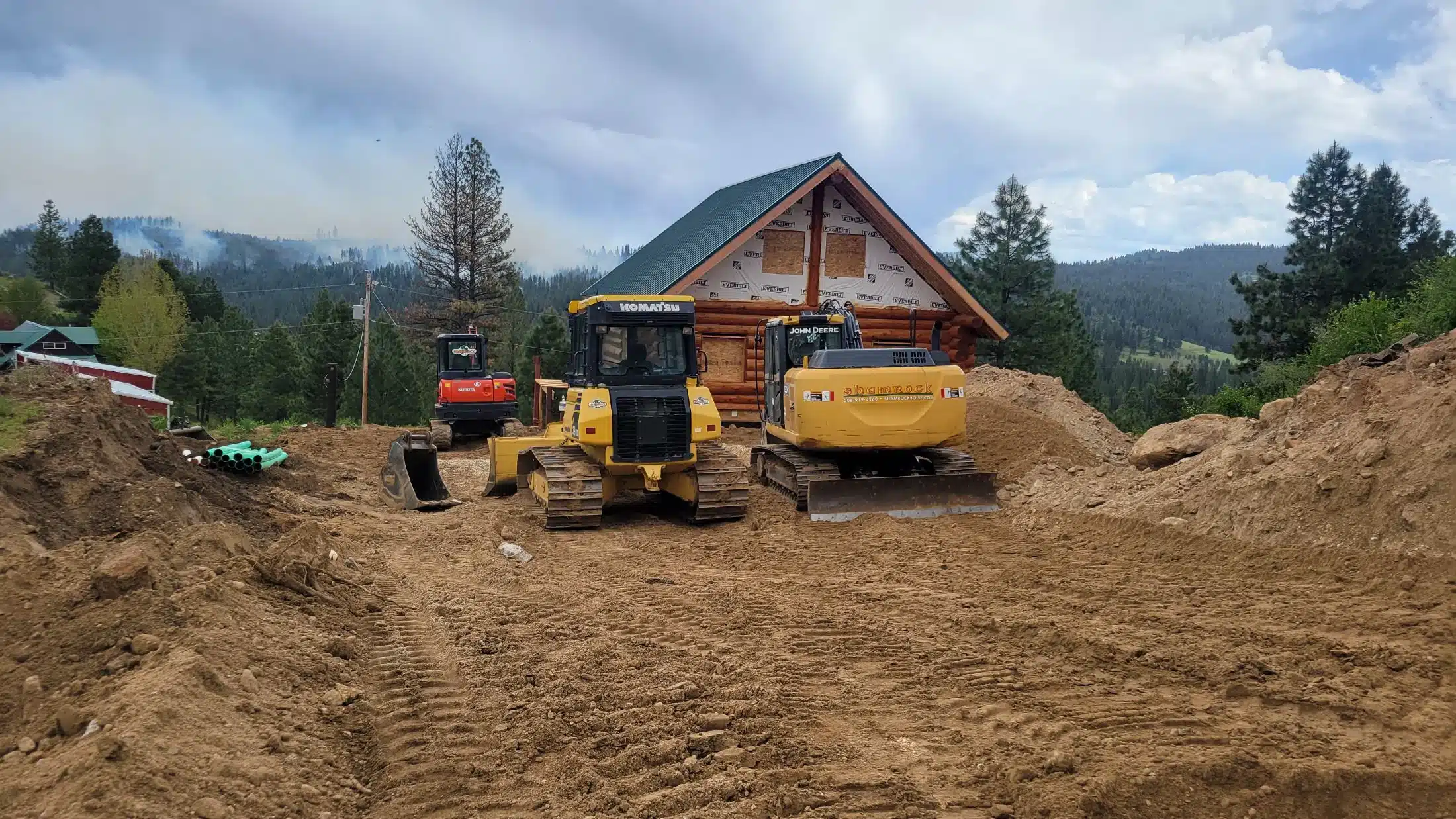 Shamrock Construction excavator and dozer grading a homesite in the Boise, Idaho foothills