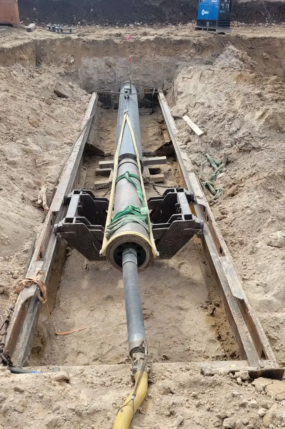 Crew repairing a broken water line in a deep trench in the Treasure Valley