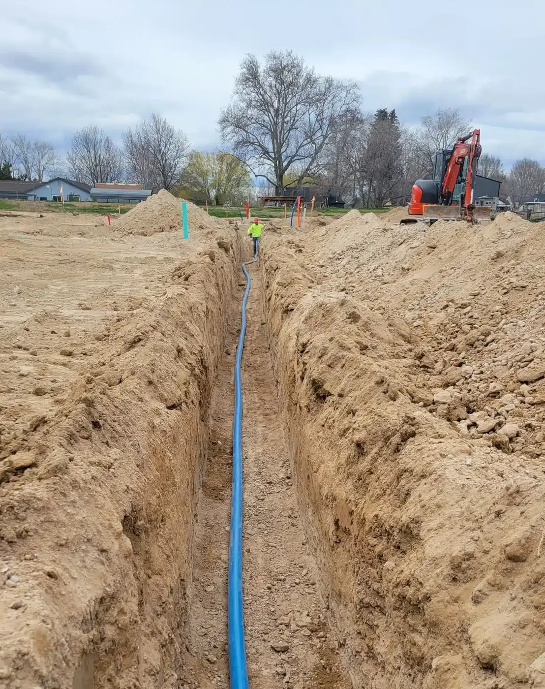 New water line being installed in a trench on a Treasure Valley property